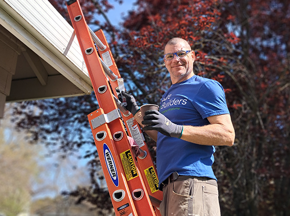 RTP volunteer on ladder RTP volunteer on ladder